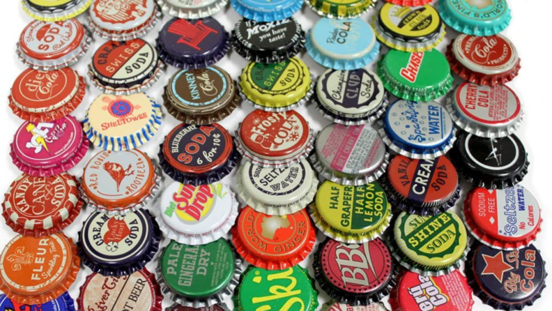 Assorted multi-colored vintage bottle caps.