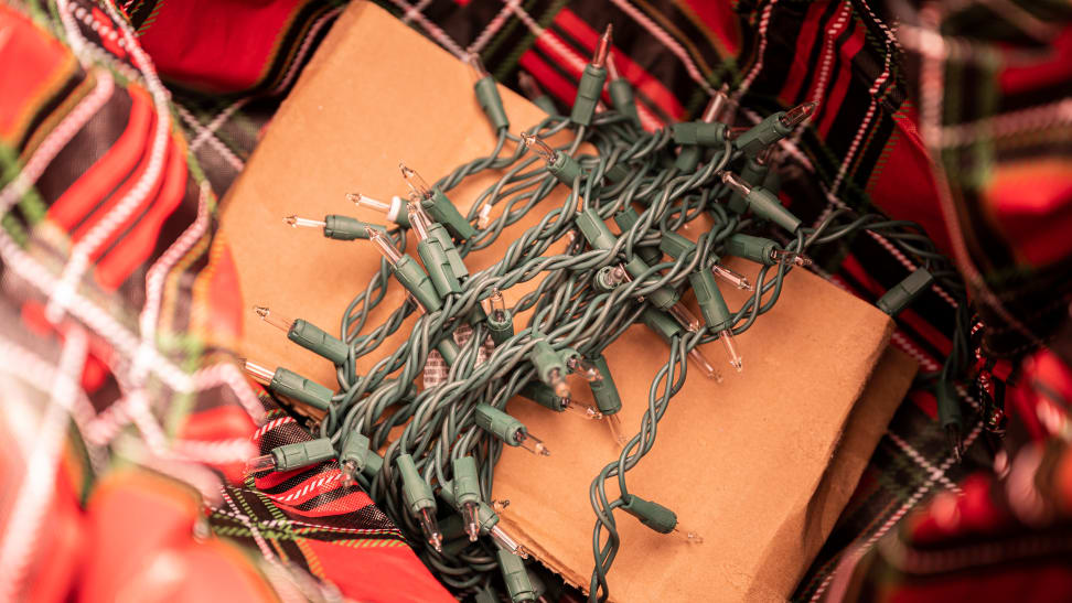 String lights are wrapped around a piece of cardboard