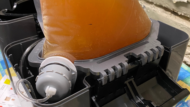 In a beer dispenser, a bag of freshly brewed beer is securely fitted into the center chamber. Connected by two valves, it's ready to dispense beer when pressurized.