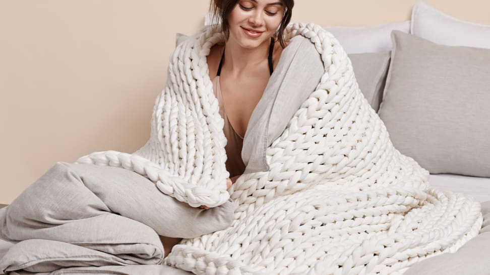 Woman wearing the Bearaby Napper blanket