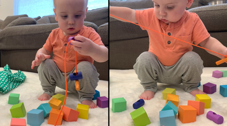 Toddler playing with blocks and string