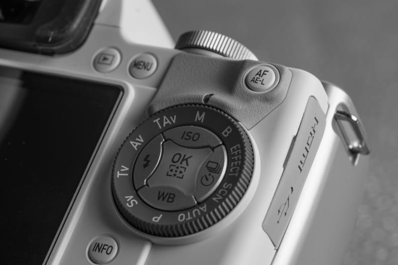 A photograph of the Pentax K-S1's mode dial and control cluster.