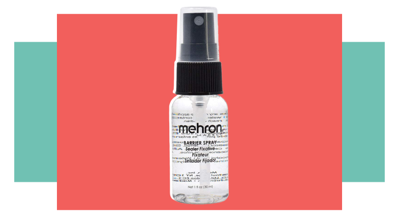 A black and clear bottle of paint setting spray.