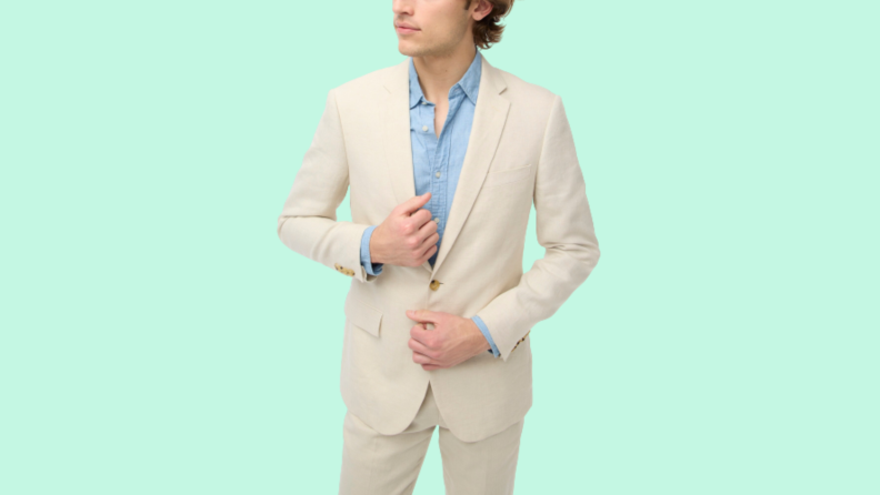 A model wearing a light tan suit.