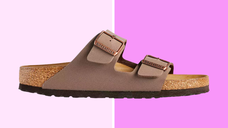 An image of a brown Arizona style Birkenstock slide sandal, with a cork footbed and two broad, over-the-foot straps.