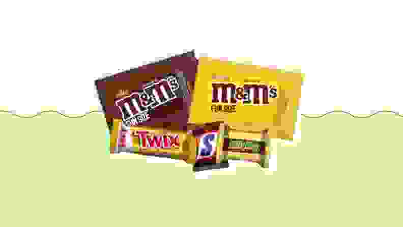 Various chocolate candies on a green and beige background
