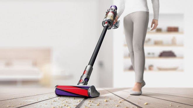 Woman vacuuming crumbs