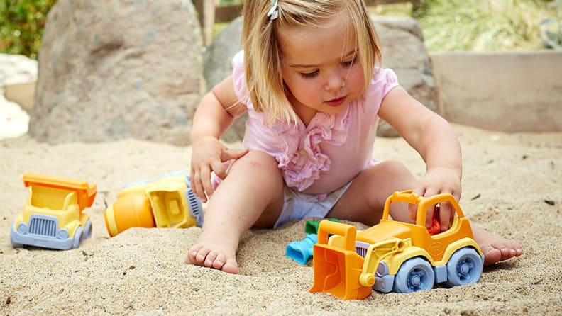 girl playing in sand