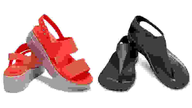 Red Crocs platform sandals and black crop t-strap Crocs sandals on white background.