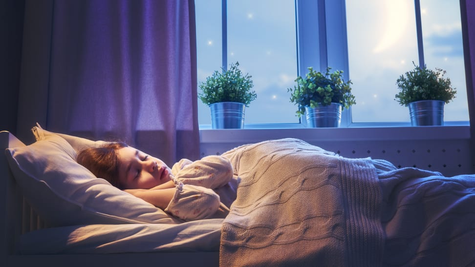 Girl sleeping peacefully in bed