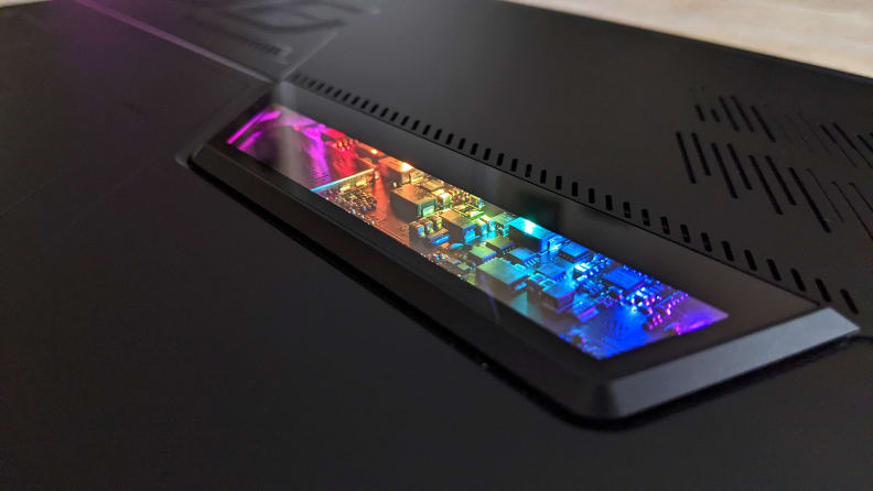 A close up a computer circuitry lit up with rainbow colors