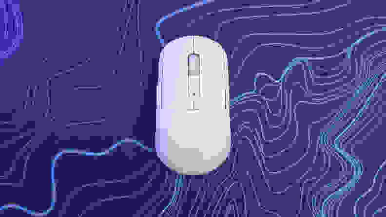 An aerial view of the Turtle Beach Burst II Air mouse on top of a purple and blue patterned mousepad.