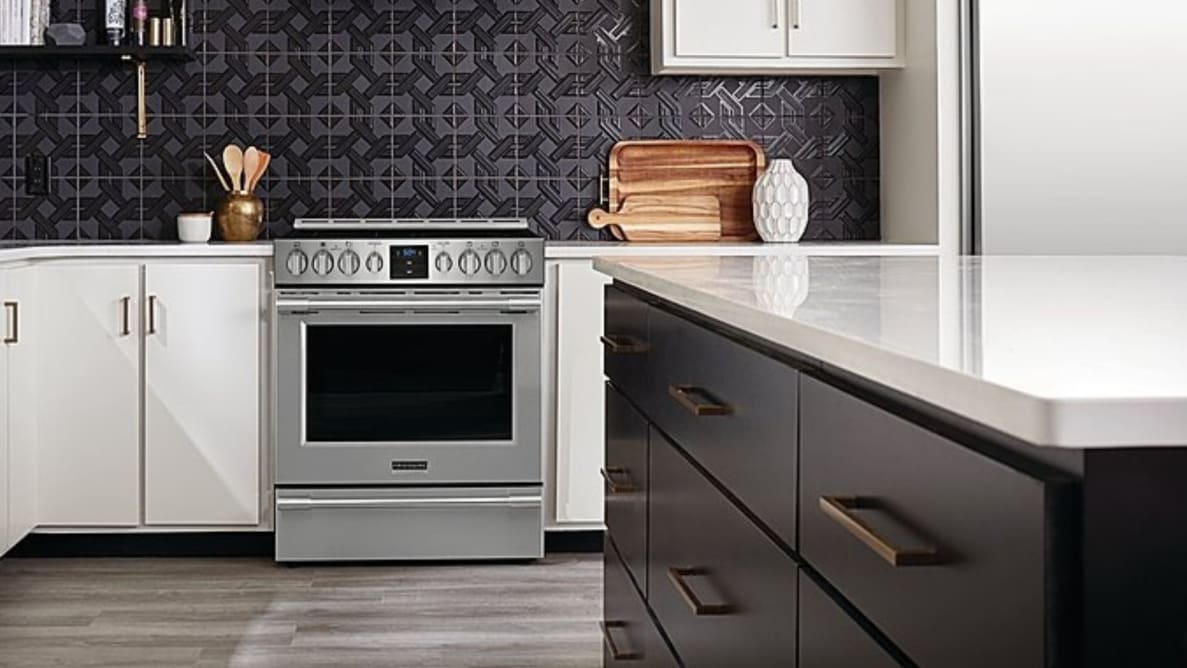 A Frigidaire Professional PCFE3078AF electric range, nicely fitted into the white cabinets of the kitchen.