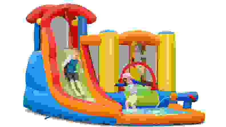 Kids jumping and swimming in a bounce house with a wading pool