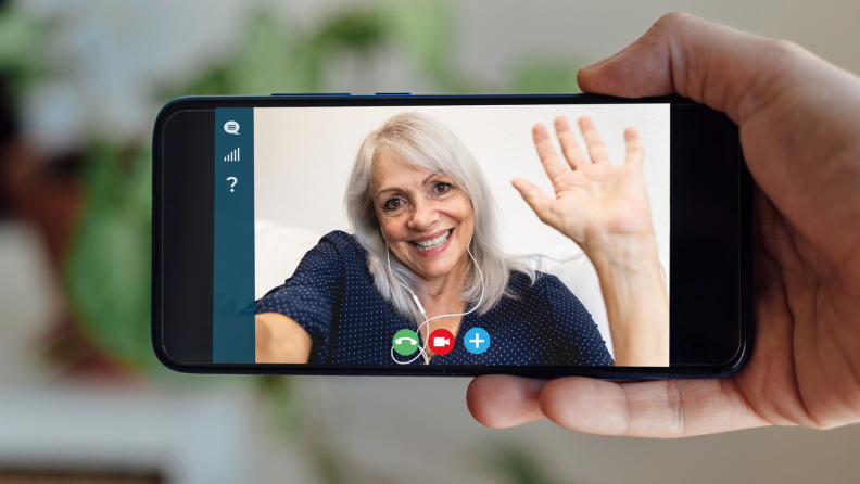 A person stays connected with a friend via Zoom.
