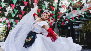 Woman dancing in a Mexican culture celebration