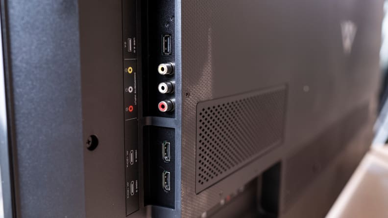 A close-up photo shows the various HDMI and A/V ports on the side of a Vizio TV.