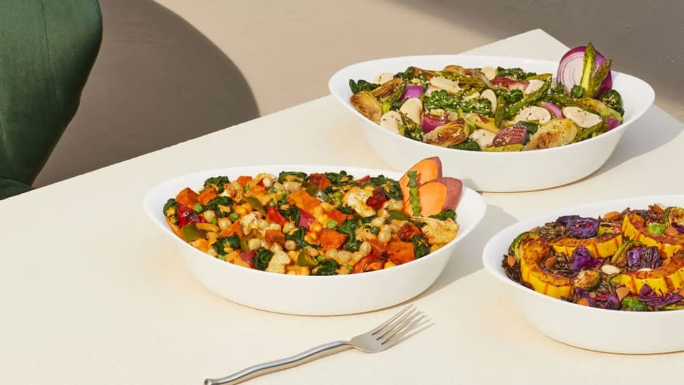 On left, raw veggies and other ingredients placed in Harvest Bakes-sized bowl. On right, hand digging into ready-to-eat Harvest Bakes with a fork, toaster oven in background.