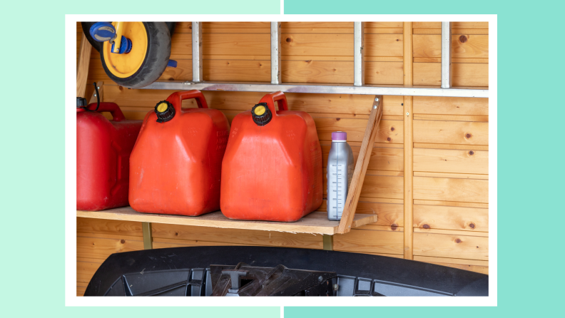 Red gas containers sitting on shelf inside of wooden shed.