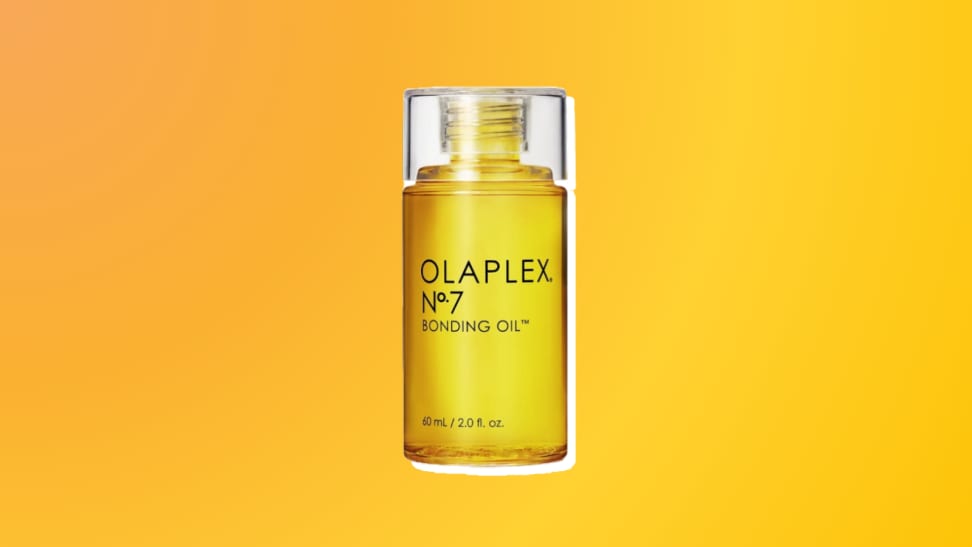 Olaplex hair oil against an orange and yellow background.