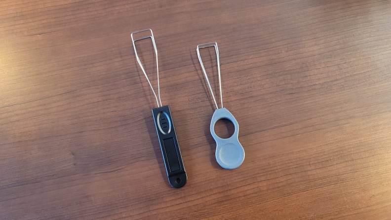 Two wired keycap pullers next to one another