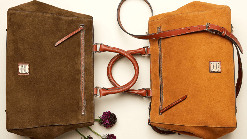 Two Dooney & Bourke suede handbags on their sides