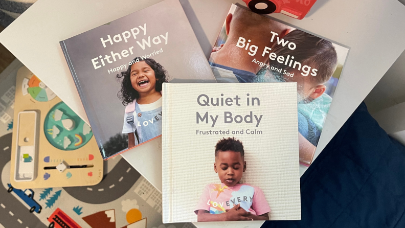 Three children's books on a nightstand