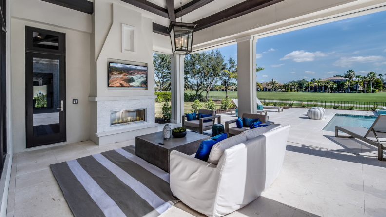 Modern outdoor patio next to golf course.