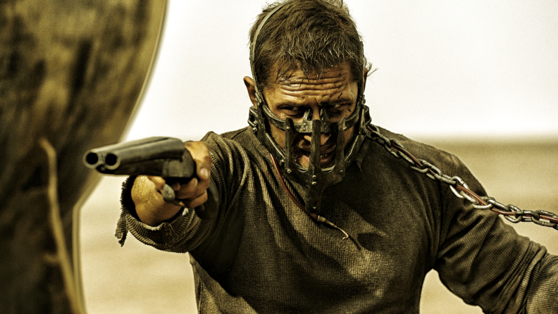 In a still from Fury Road, Mad Max Rockatansky aims a sawed-off shotgun.