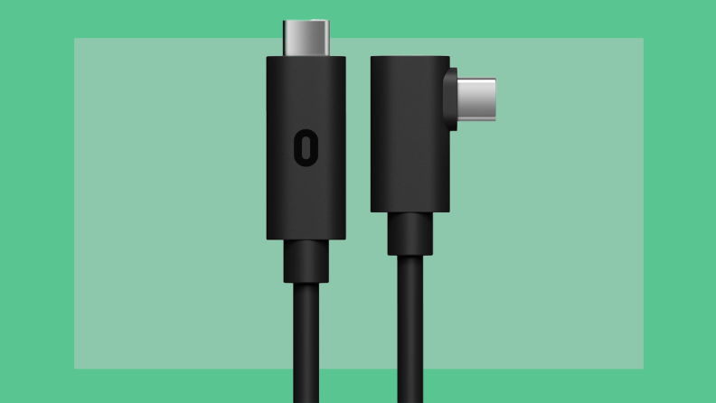 Product shot of the Oculus Link Cable featuring both ends of the cord in front of green background.