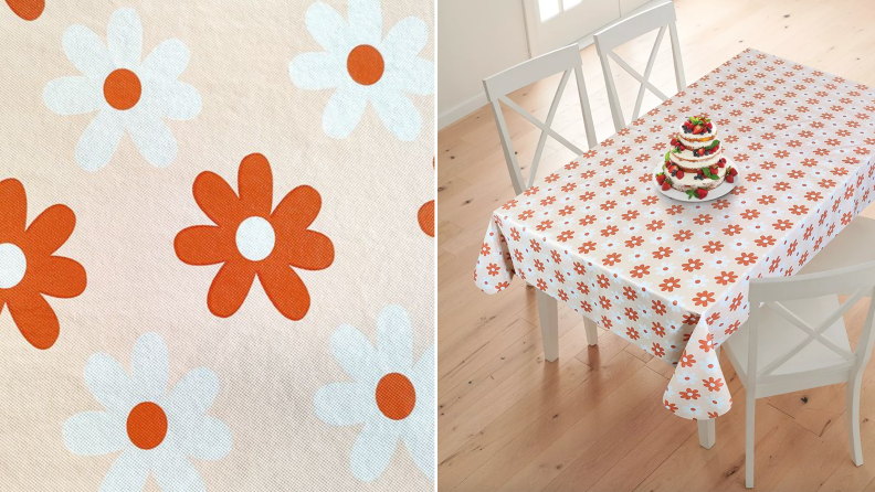 Product shot of orange and white floral printed tablecloth.
