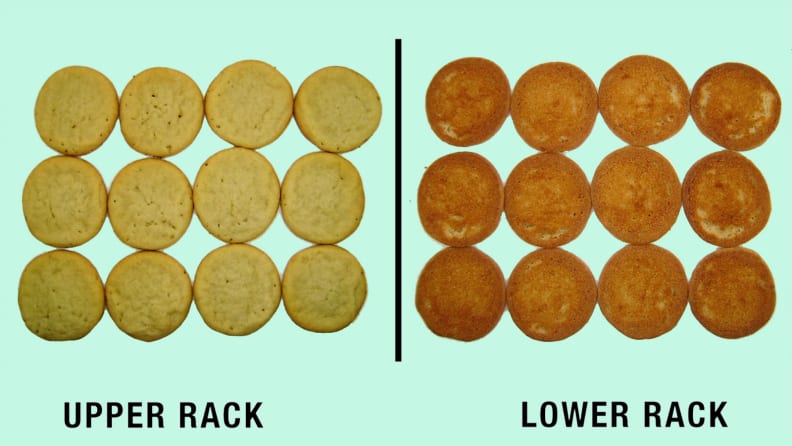 Two dozen cookies showing the golden difference of cooking on the upper rack and the lower rack.
