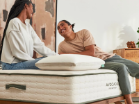 Photo of two people on an Avocado mattress.
