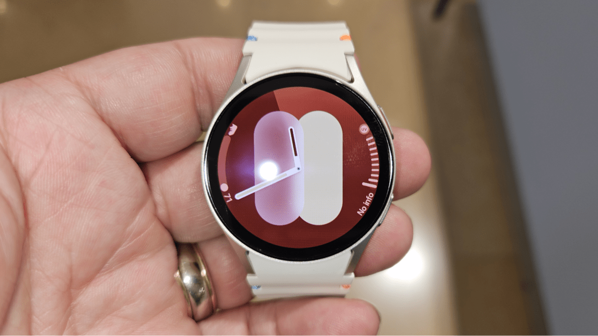 Close-up of a hand holding the Samsung Galaxy Watch7.