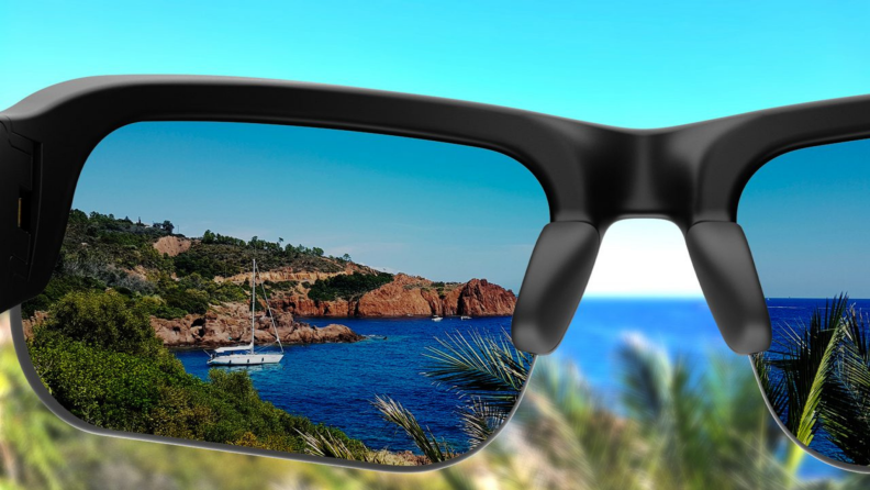 First person perspective: looking through the Bose with tinted frames at rocky shoreline cliffs.