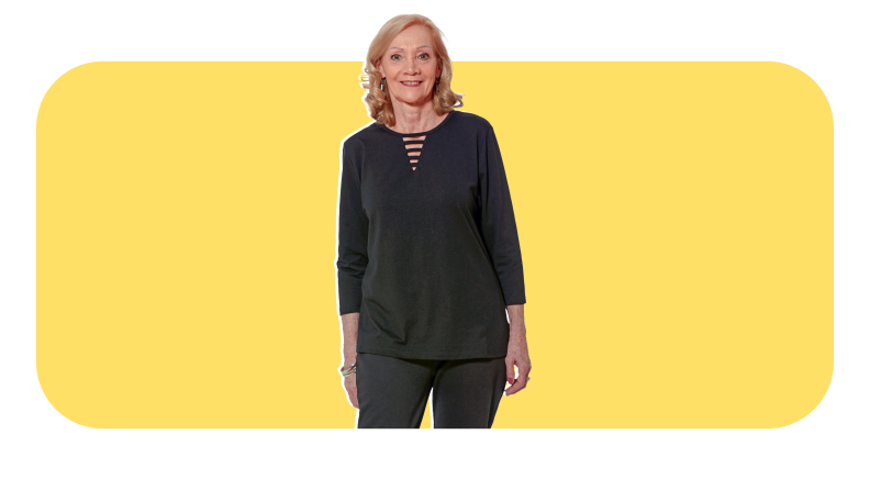 Model wearing black, long-sleeve adaptive shirt from Walmart
