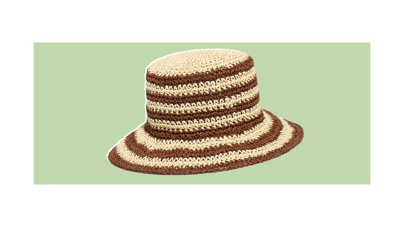 A crocheted straw bucket hat with natural and brown stripes.