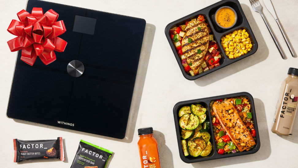 Factor prepared meals, snacks, and drinks displayed alongside a Withings smart scale, shown as part of a promotion using the Factor promo code.