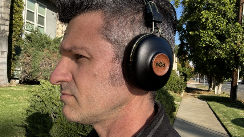 A man wearing the Marley Positive Vibration Frequency Headphones outside.