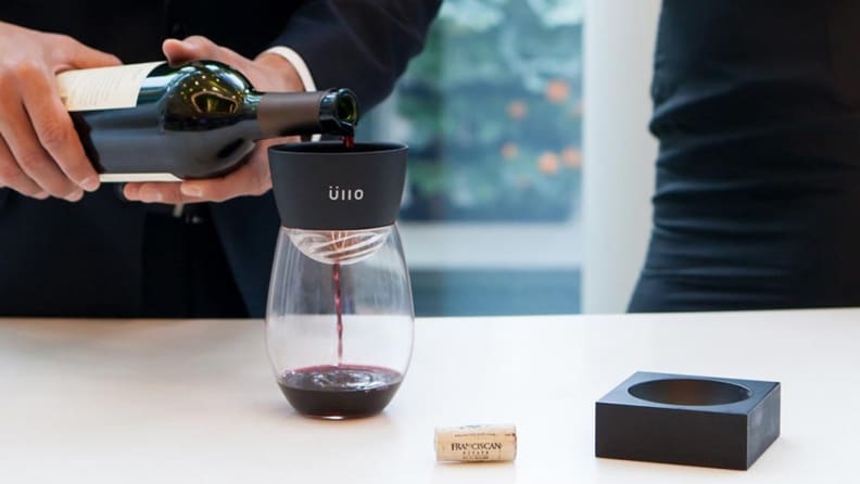Wine being poured into a glass through the Ullo filter.