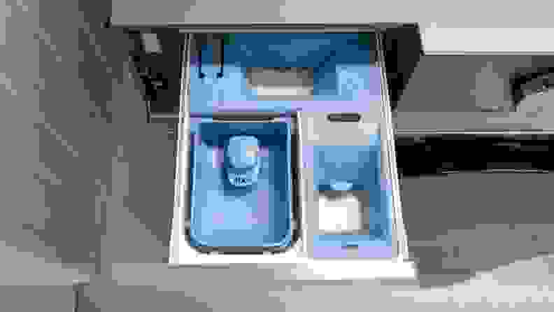 View of the three compartment detergent dispenser inside of the amsung WF53BB8700AT Front-load Washing Machine.