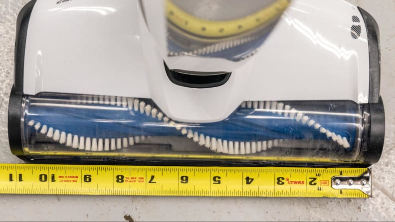A measuring tape showing the 11-inch width of the Hoover Evolve