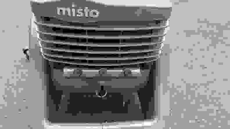 Front view of the Lasko Misto showing the name, fan vents, and mister nozzles.