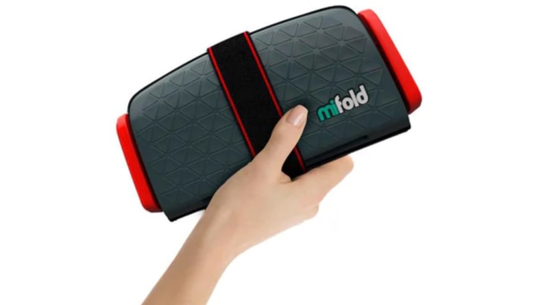 A hand holds the Mifold booster