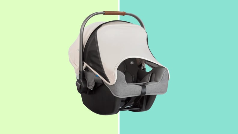 The Nuna Pipa car seat with the canopy feature in use.