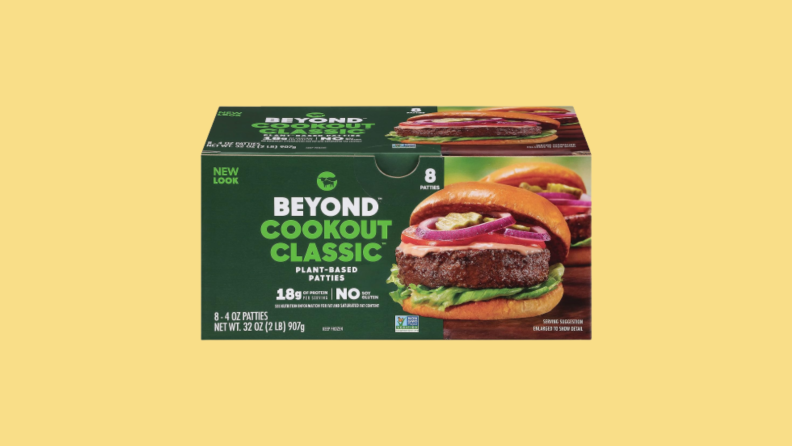 Box of Beyond burgers against yellow background