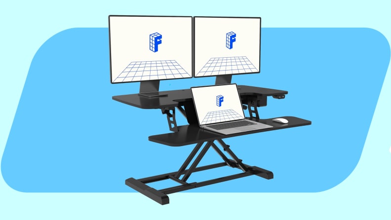 FlexiSpot standing desk converter on a blue background.