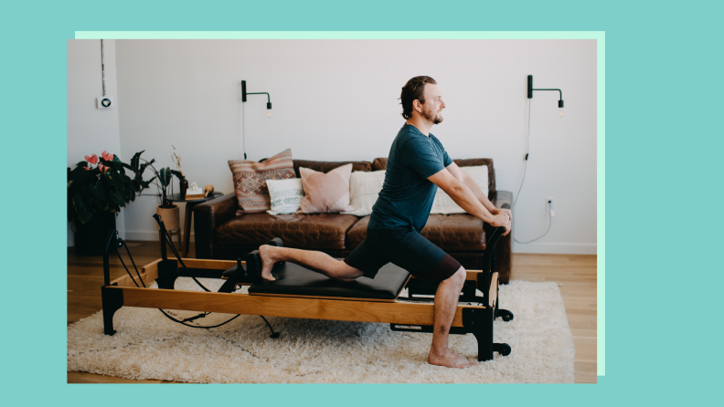 A person standing in a lunge with one knee resting on the Flexia reformer.