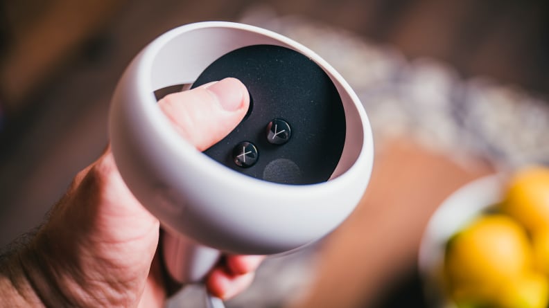 A vr headset controller in someone's hand