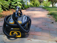 The McCulloch steam cleaner sitting on a brick walkway